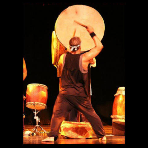 Man playing large Japanese drum